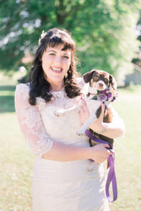 Wedding picture with flower dog in Iowa.