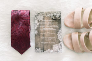 Rustic blush and burgundy wedding detail pictures.